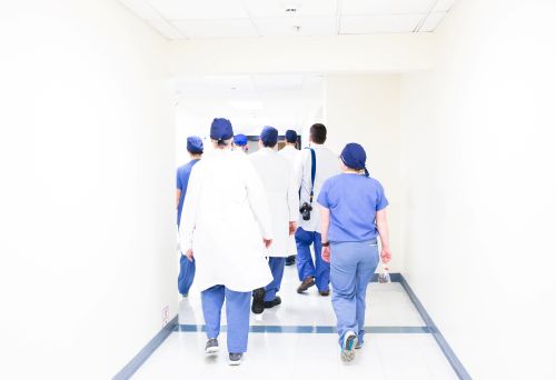 a group of physician assistants walking down a hallway